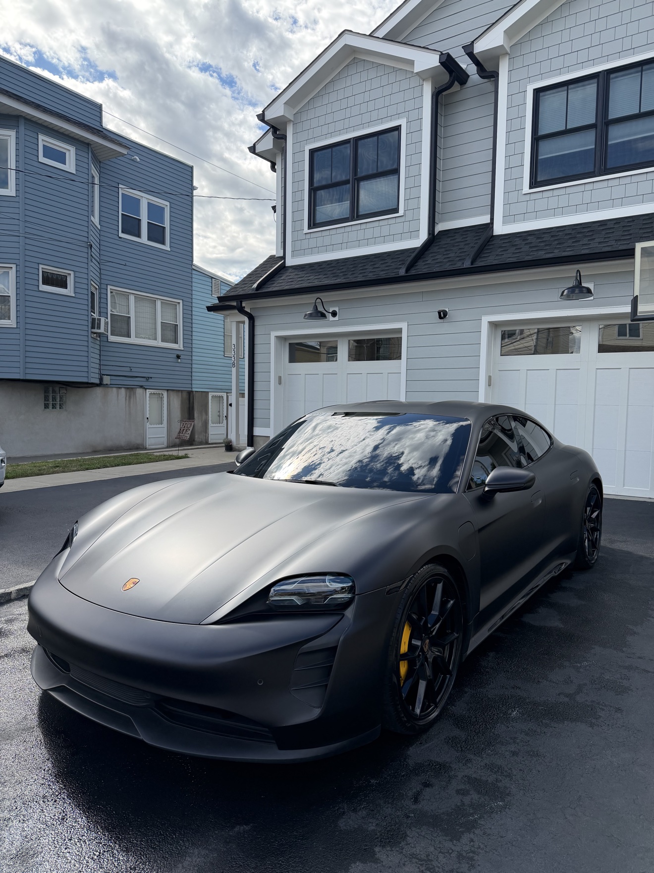 Matte black Porsche Taycan after detailing
