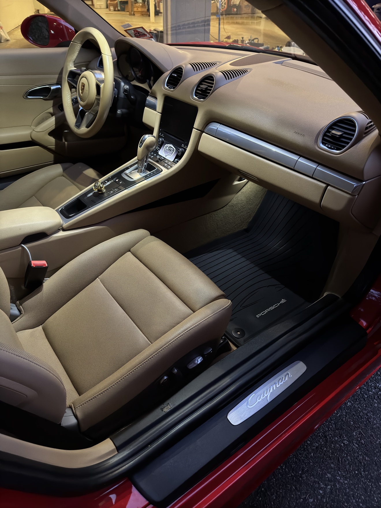 Porsche 718 Cayman cockpit with tan leather and Detailed by Yael card