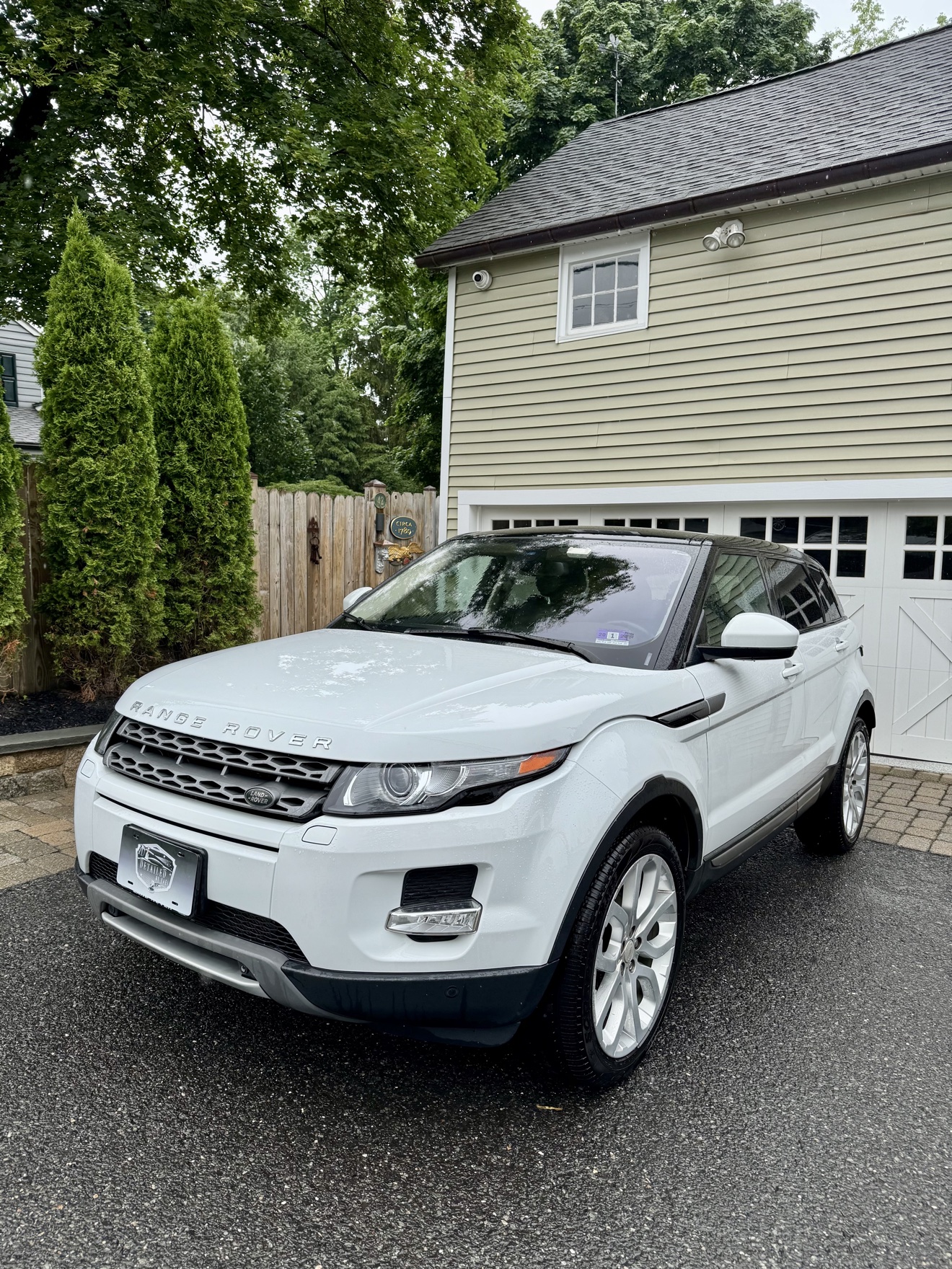 White Range Rover Evoque front three-quarter view after detailing