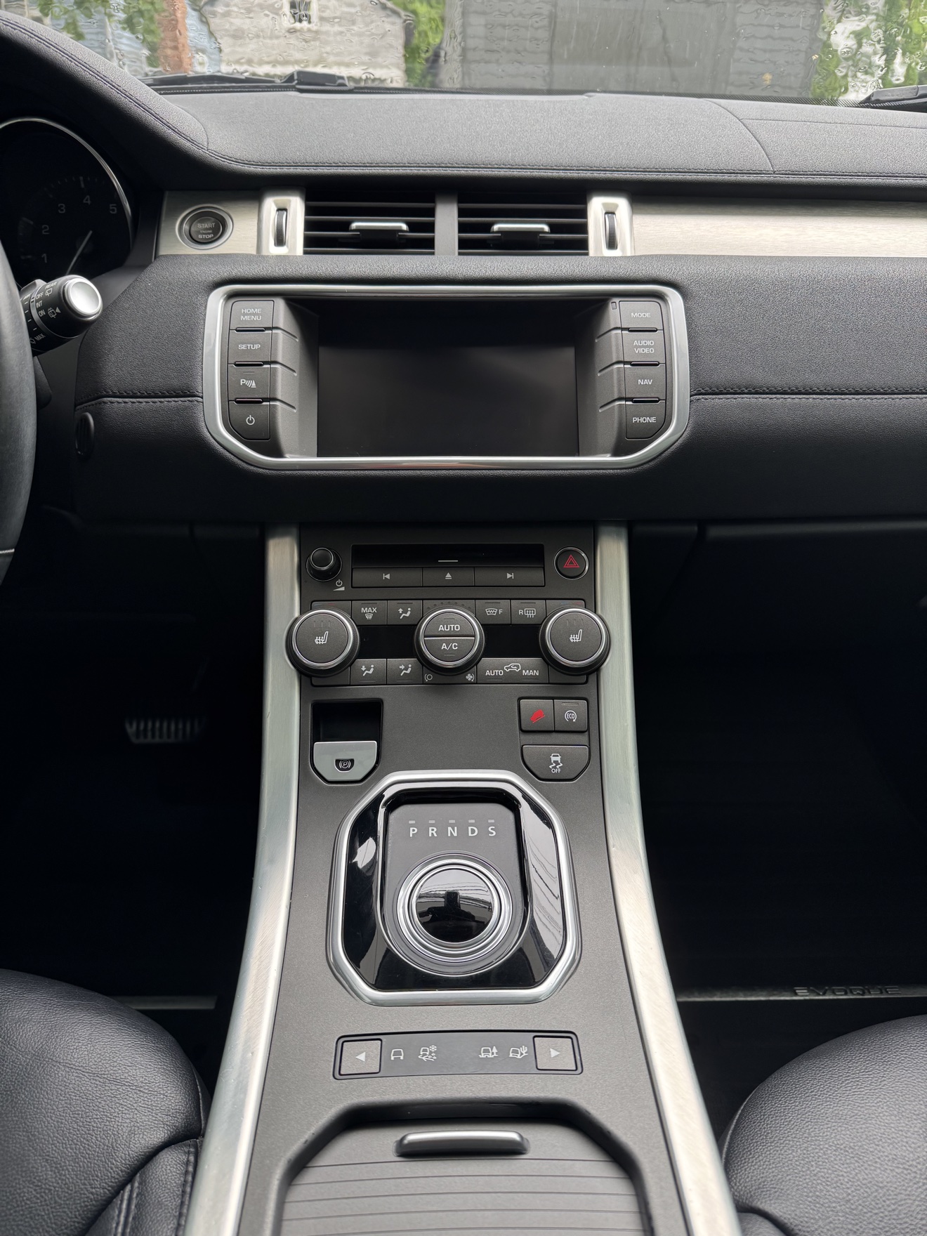 Range Rover Evoque center console with rotary shifter after detailing