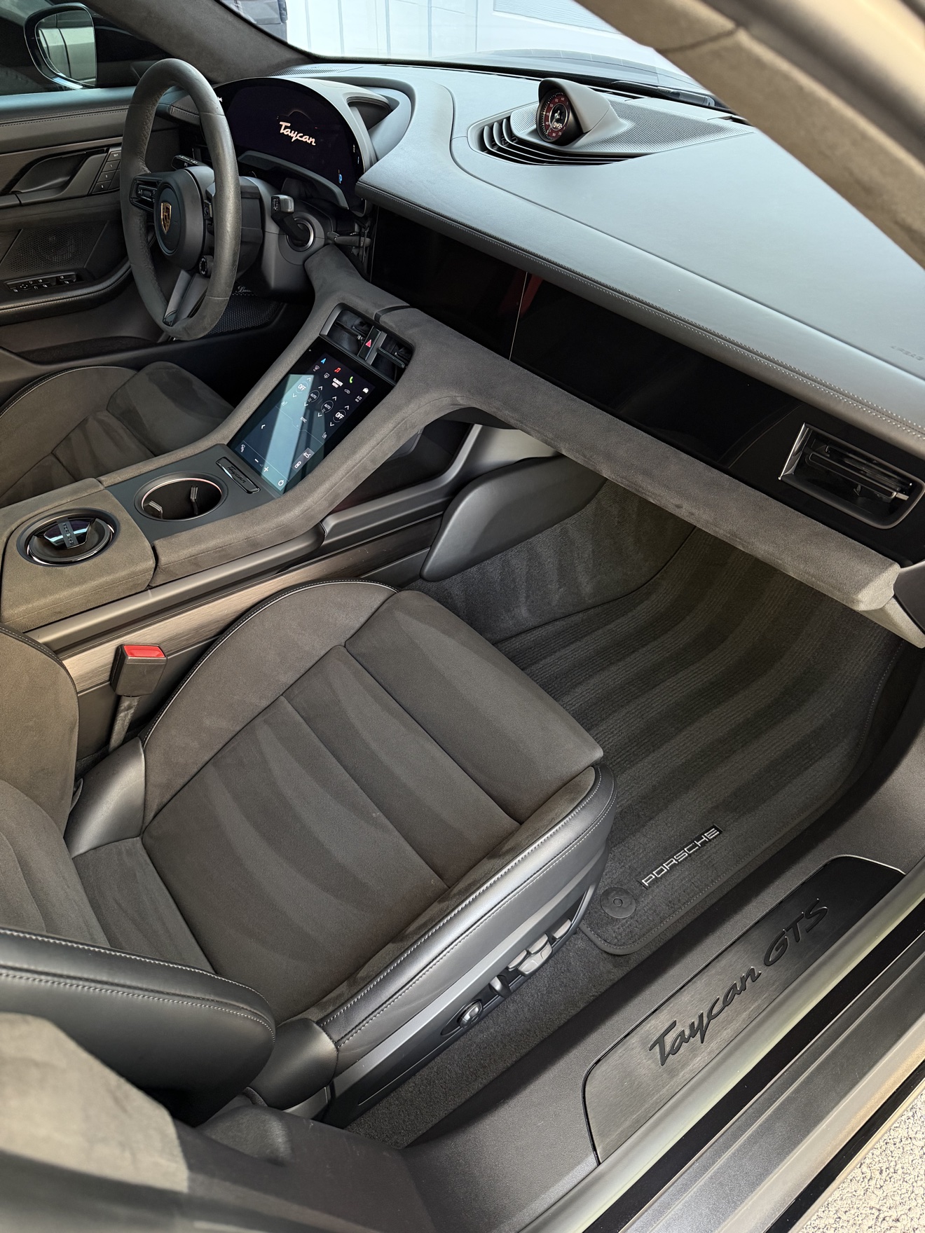 Porsche Taycan GTS passenger cockpit with Taycan badge