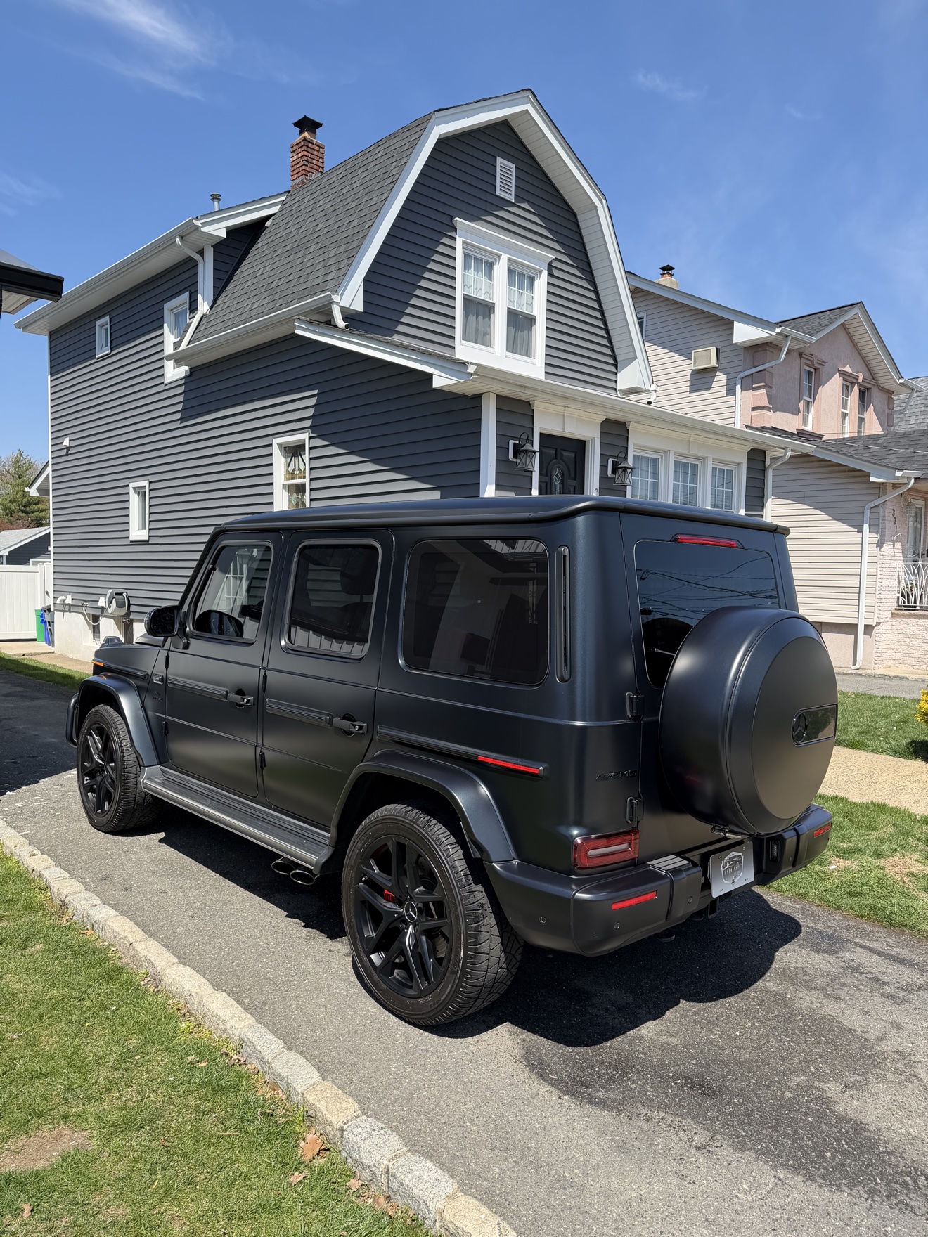 Matte black Mercedes-AMG G 63 rear angle view after detailing