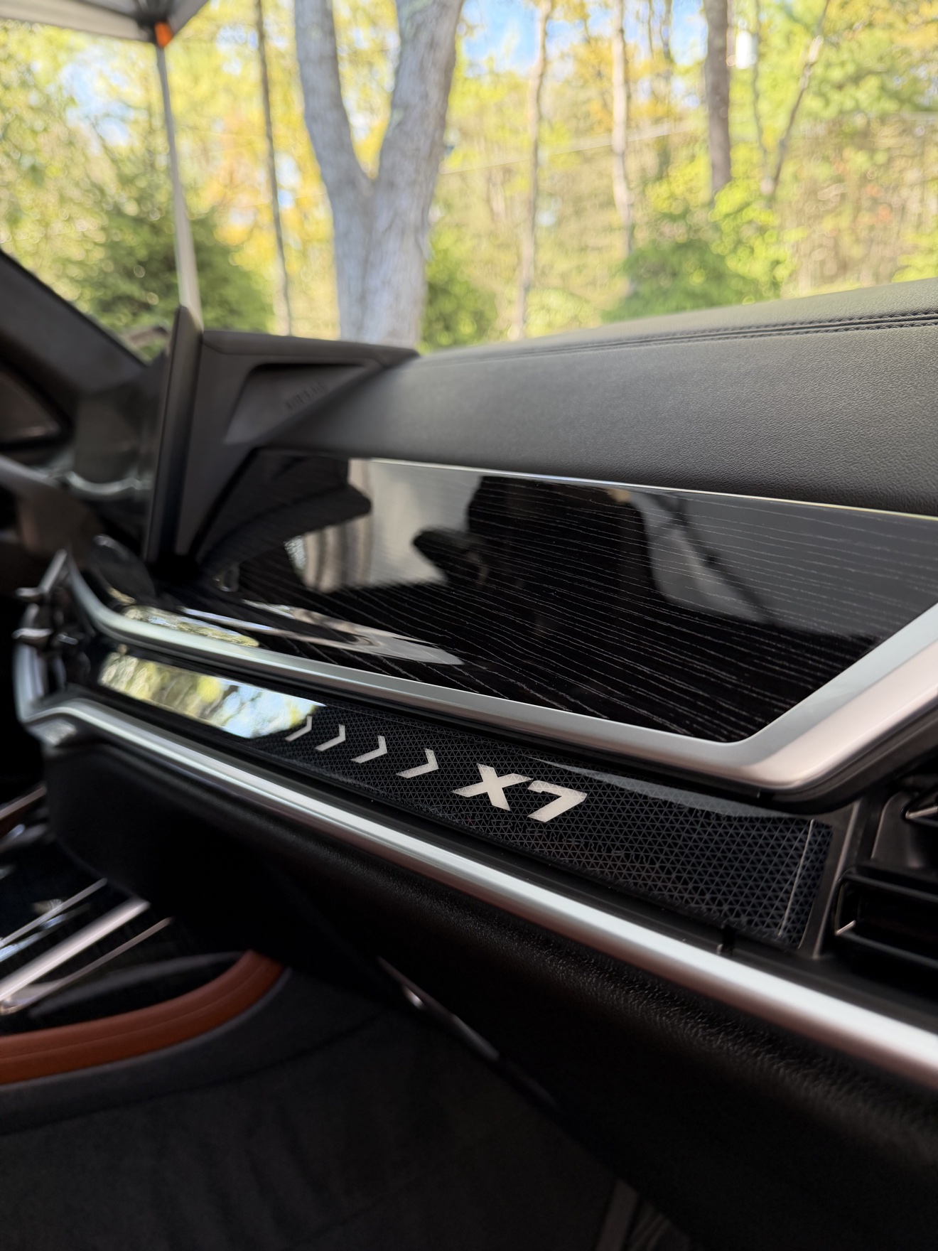 BMW X7 dashboard with X7 illuminated trim after detailing