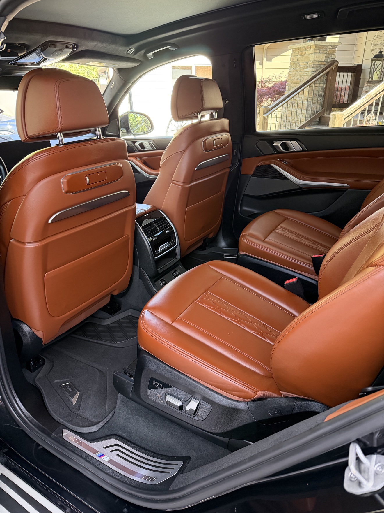 BMW X7 rear seats in cognac leather after detailing