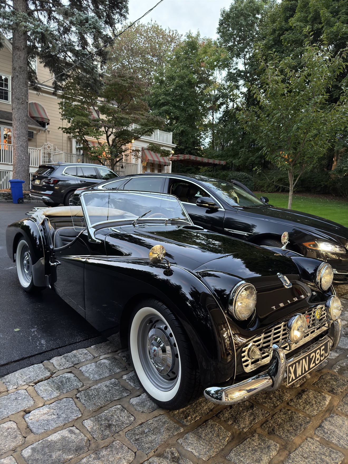 Black Triumph TR3 front three-quarter view after detailing