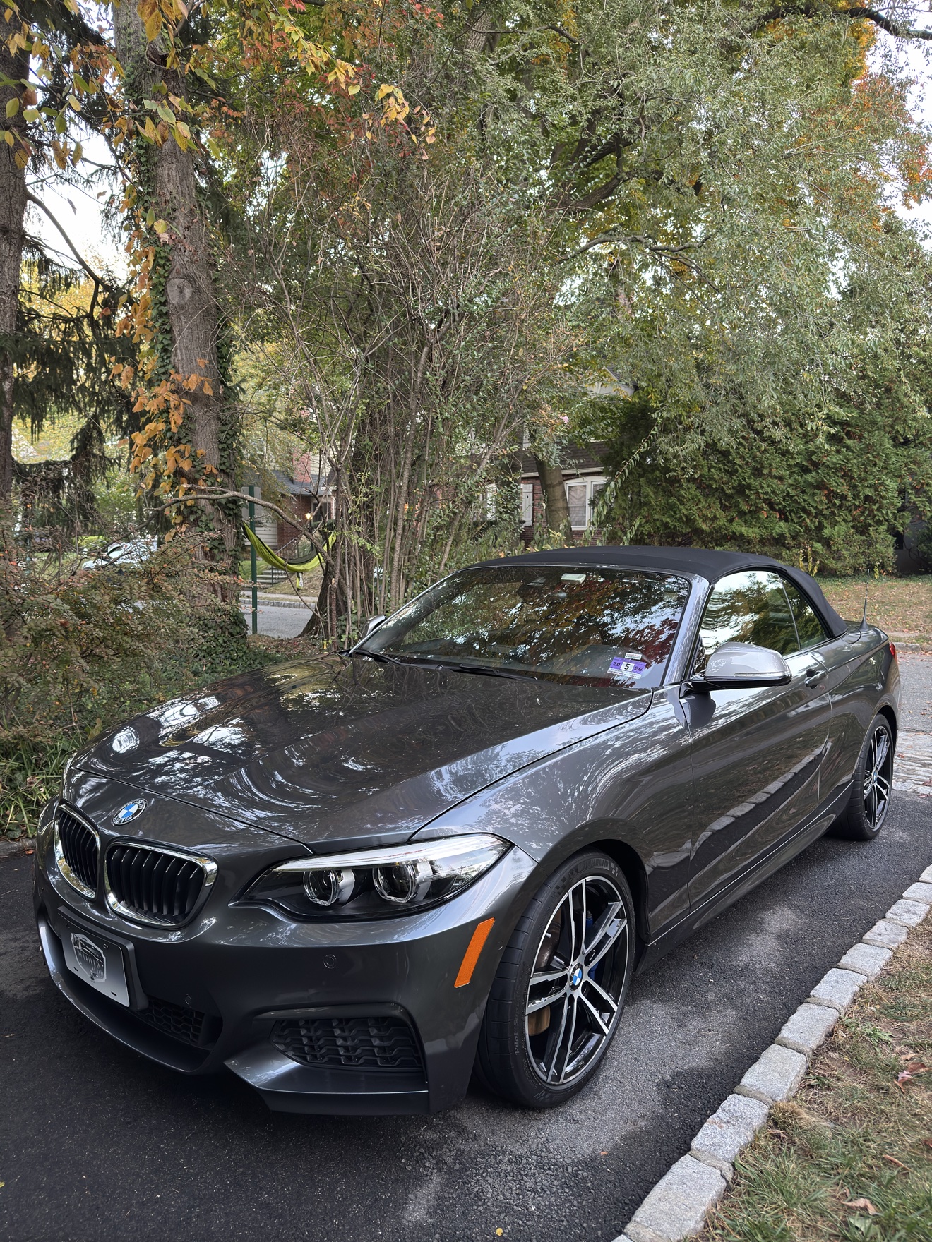 Gray BMW M240i convertible after detailing