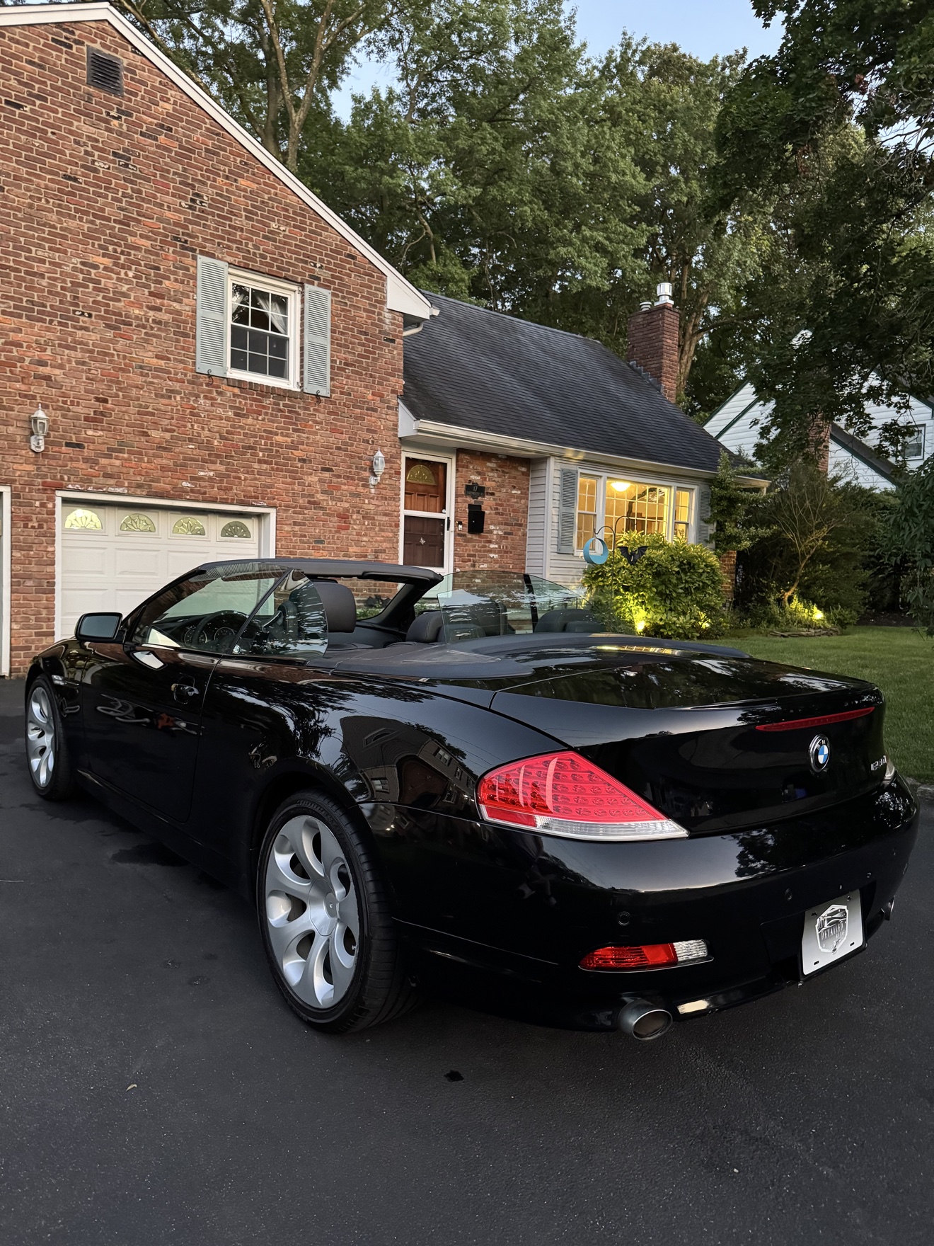 Black BMW 650i convertible rear three-quarter view with 650i badge