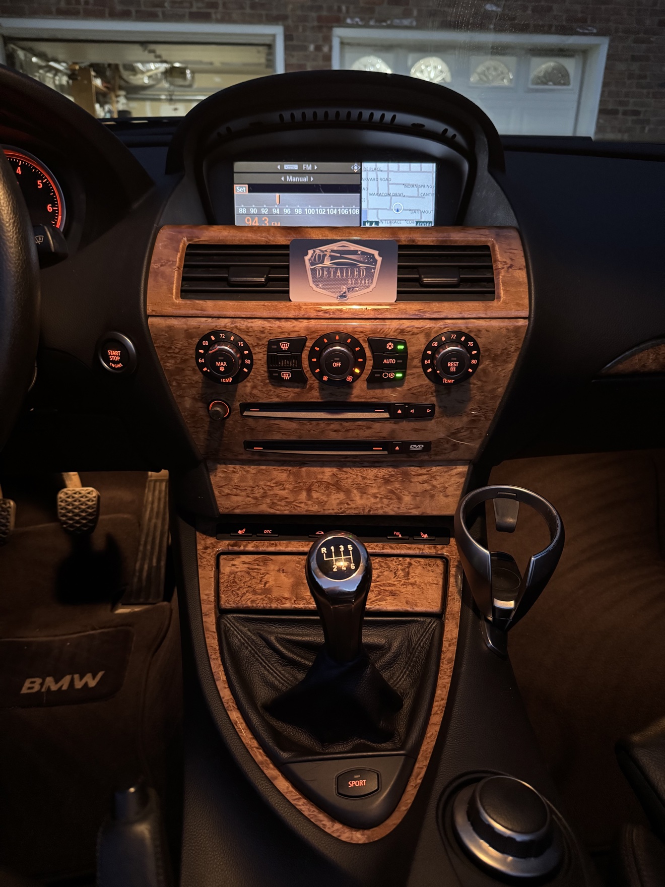 BMW 650i center console with manual shifter and Detailed by Yael business card