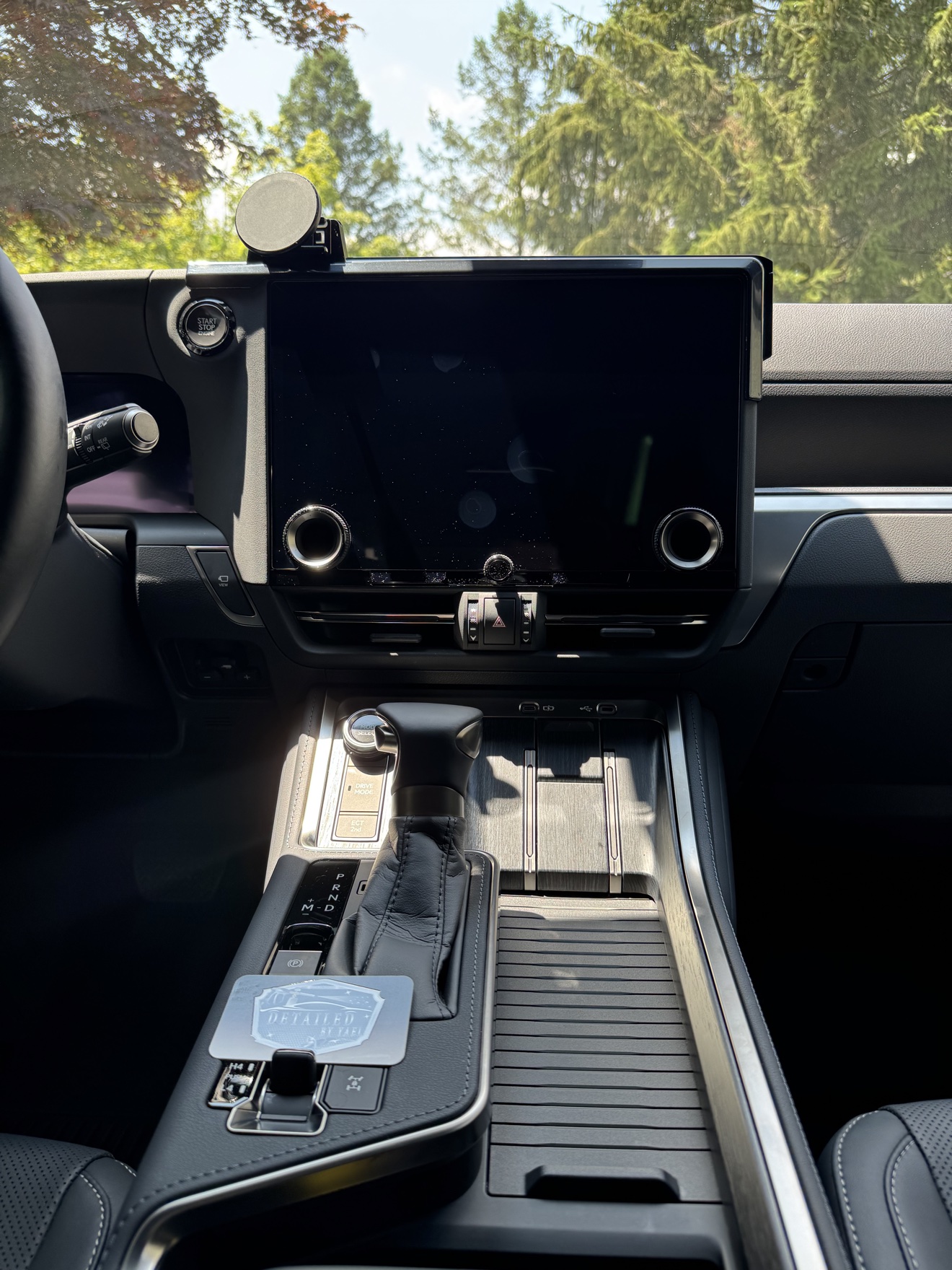 Lexus GX550 center console with Detailed by Yael business card
