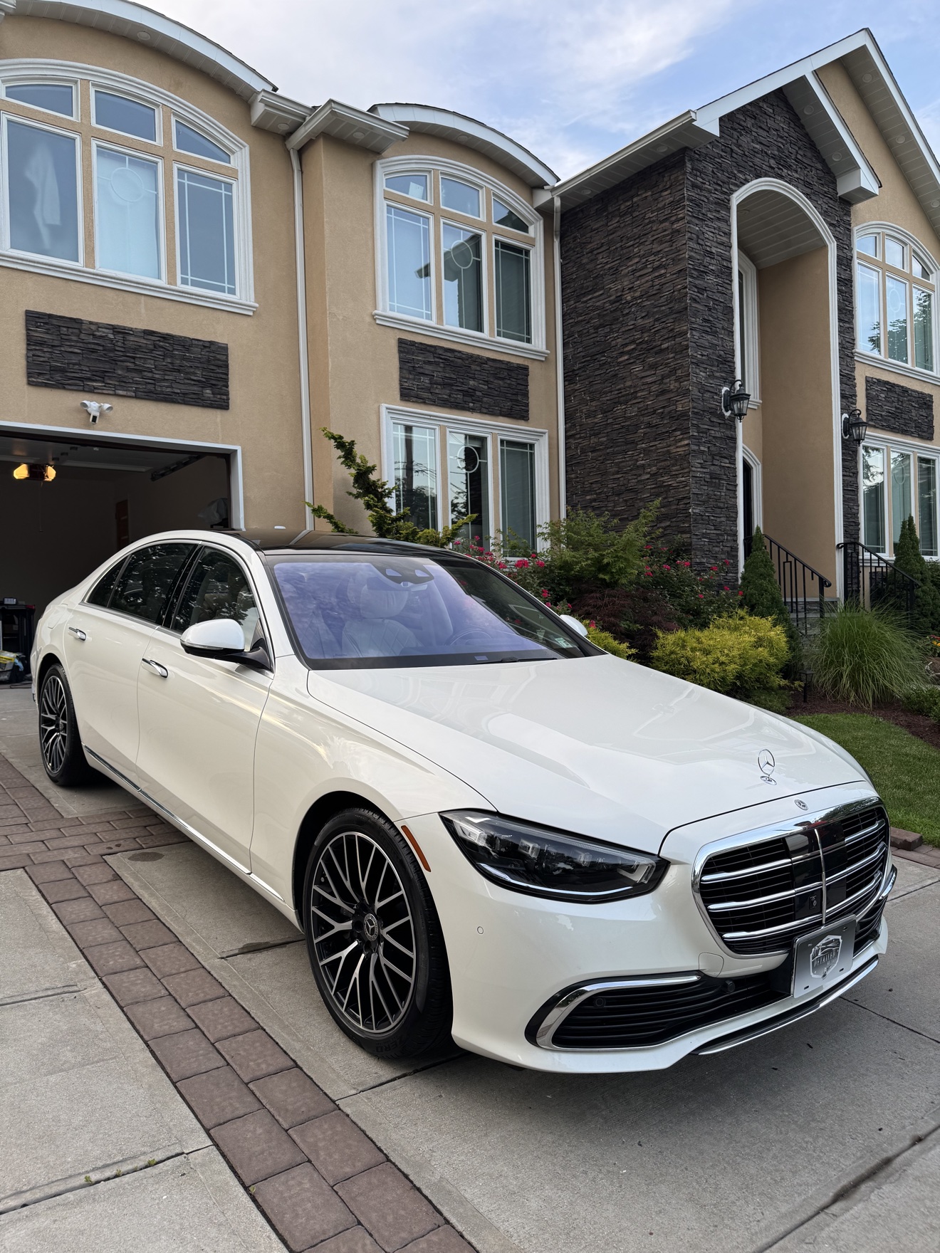 White Mercedes-Benz S580 front three-quarter view after detailing