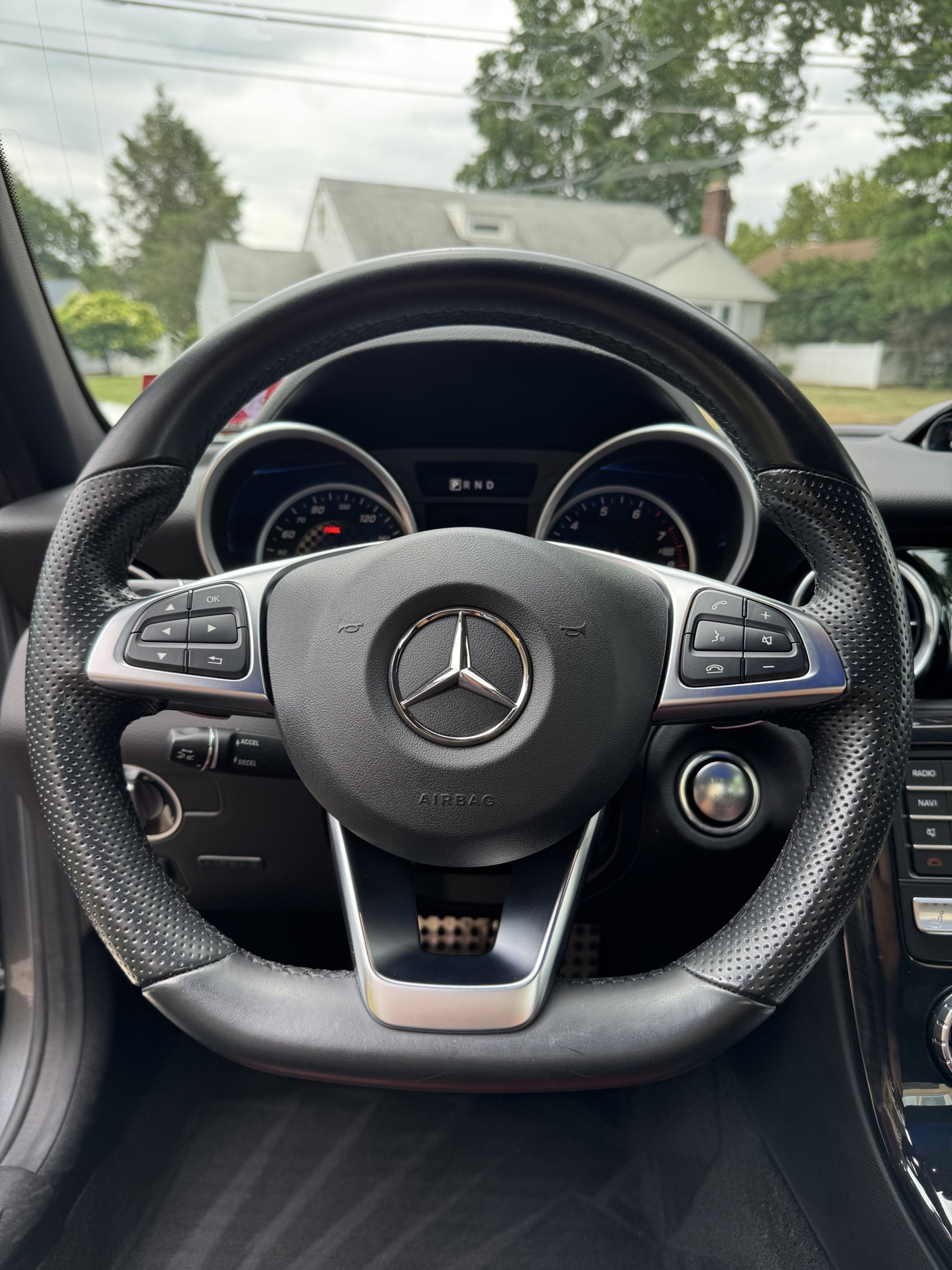 Close-up of the steering wheel and gauges in a Mercedes-Benz SLC 300