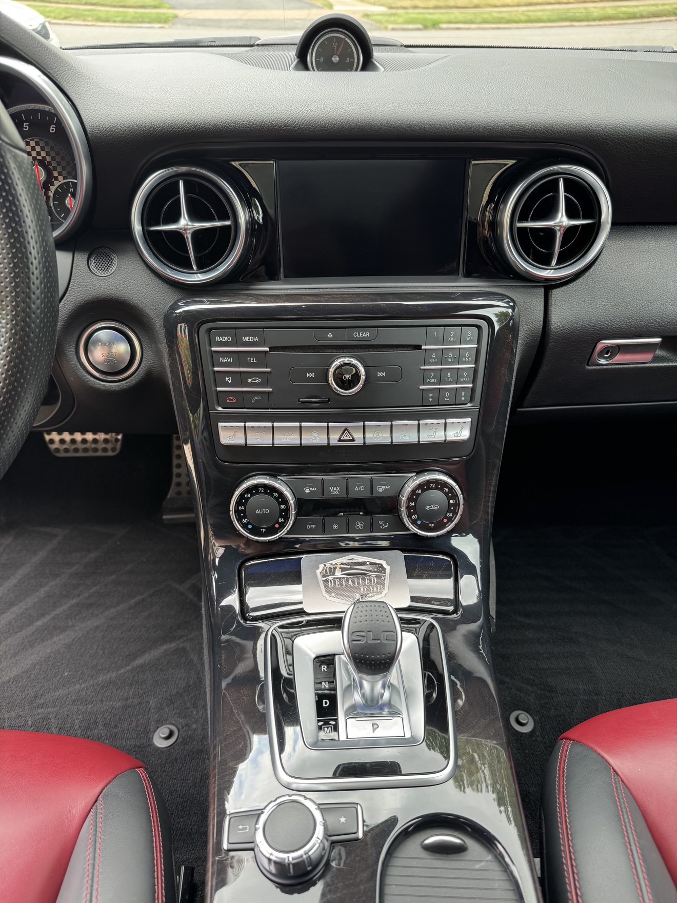 Mercedes-Benz SLC 300 center console with SLC shifter and Detailed by Yael business card