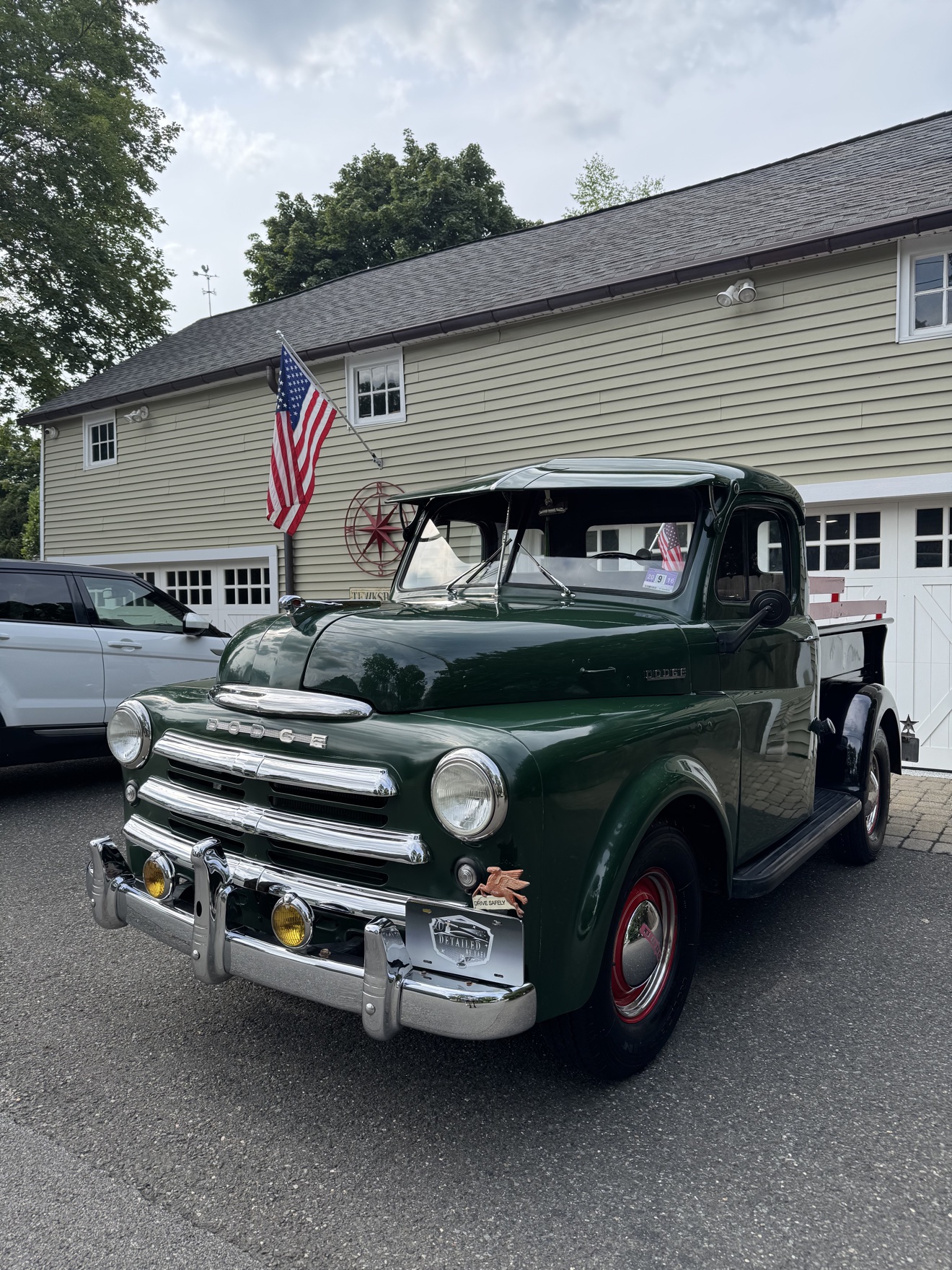 Green vintage Dodge B-Series “Pilothouse” Pickup front three-quarter view after detailing