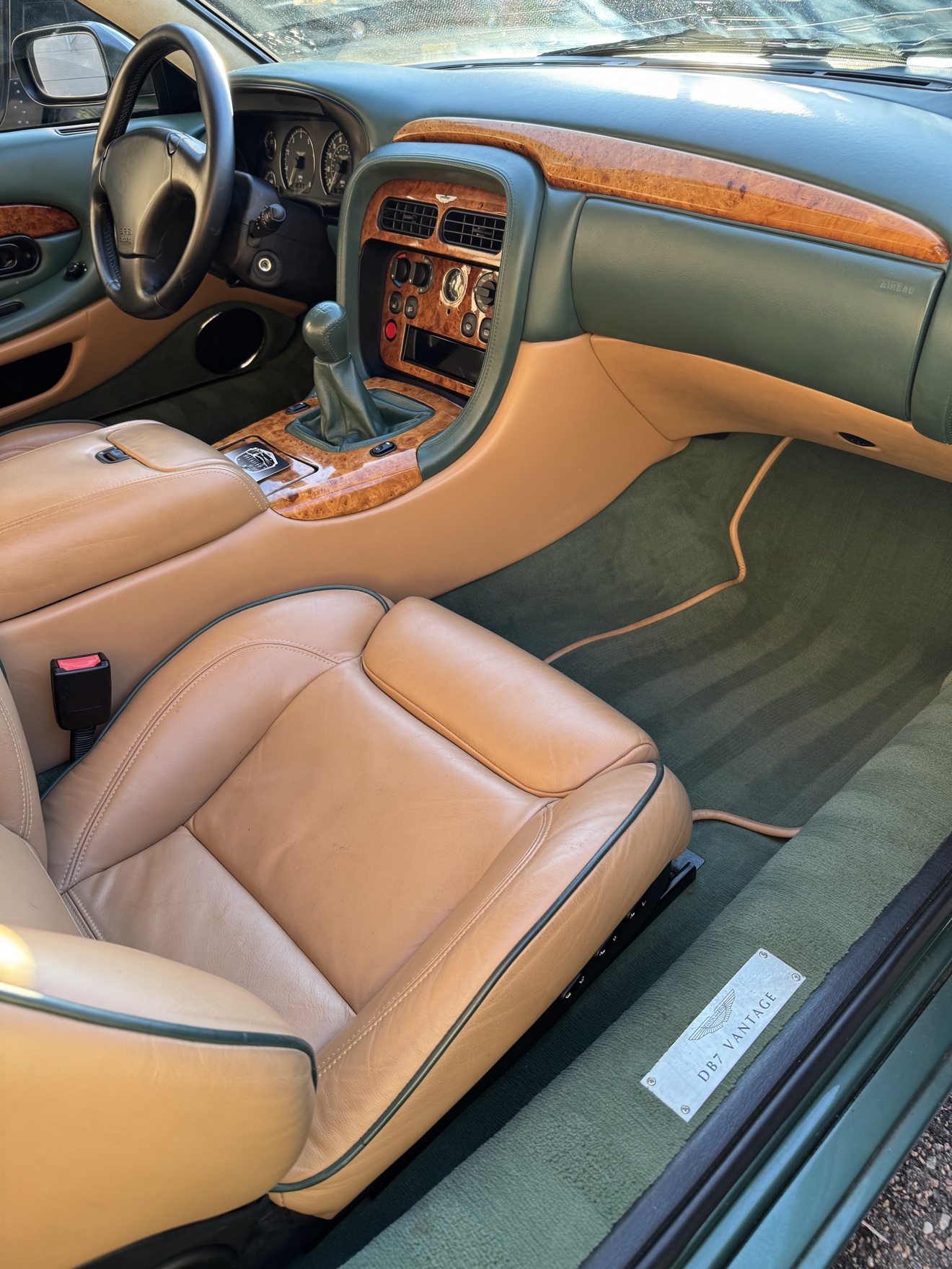 Aston Martin DB7 Vantage passenger side cockpit with tan leather and walnut dashboard