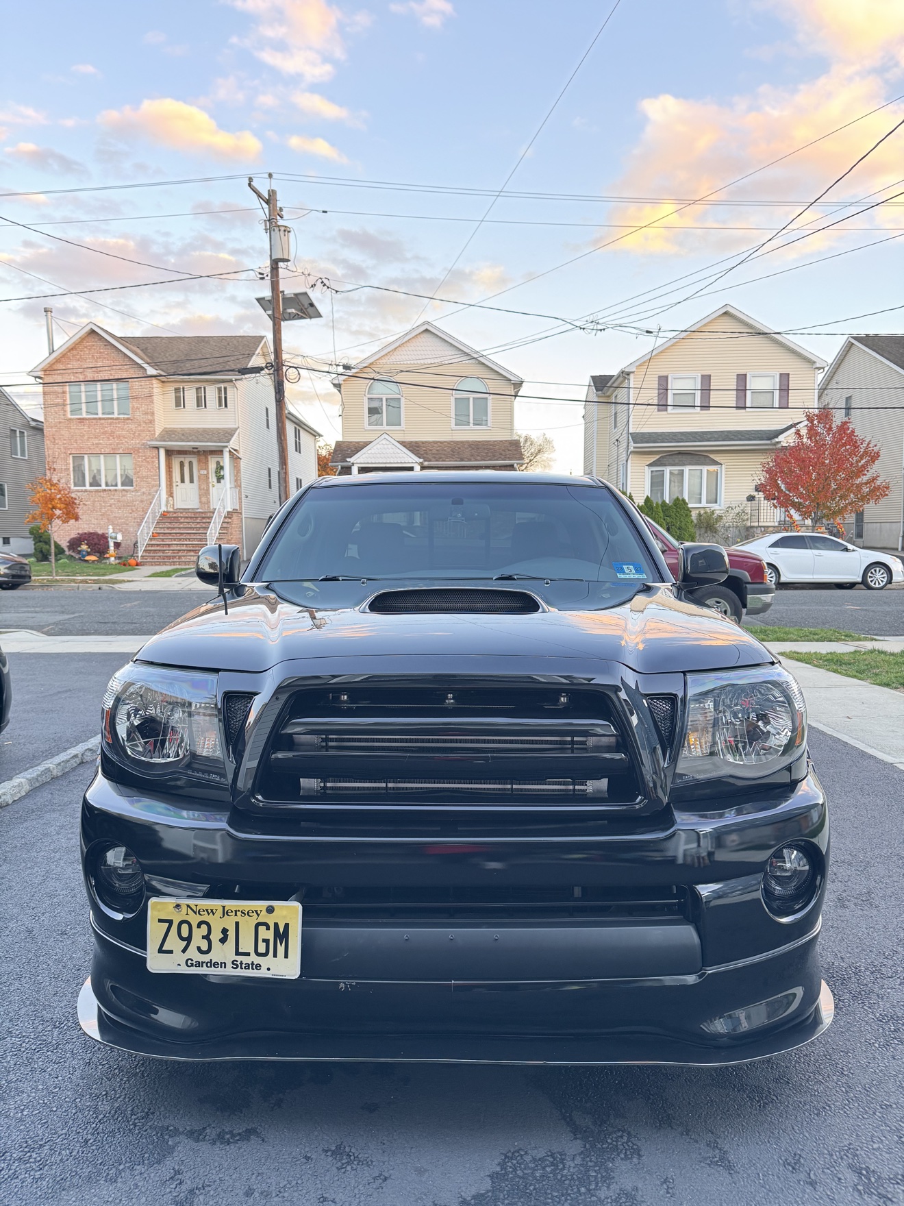 Front view of a black Toyota Tacoma X-Runner with NJ plates