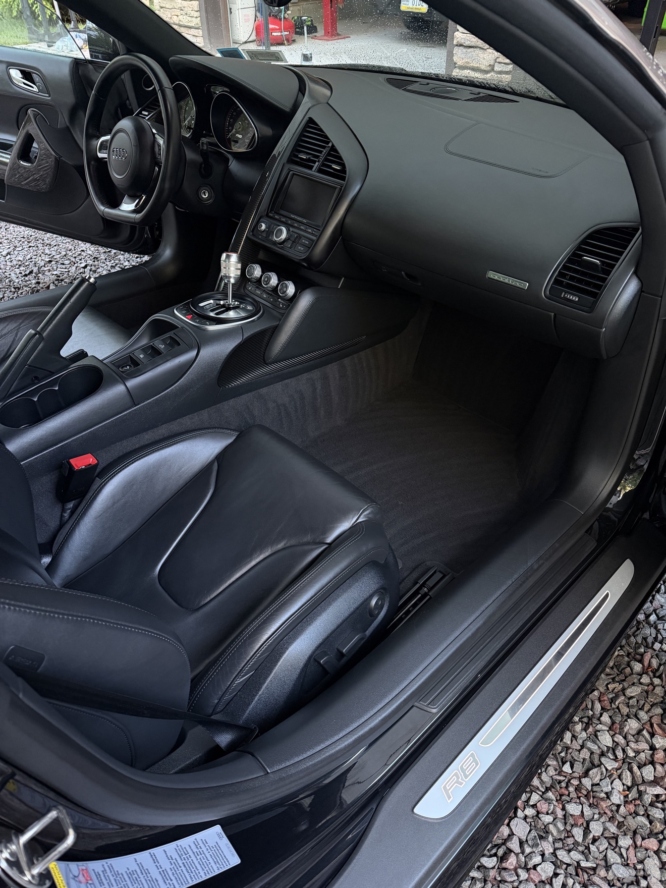 Audi R8 Spyder passenger side cockpit with black leather seats