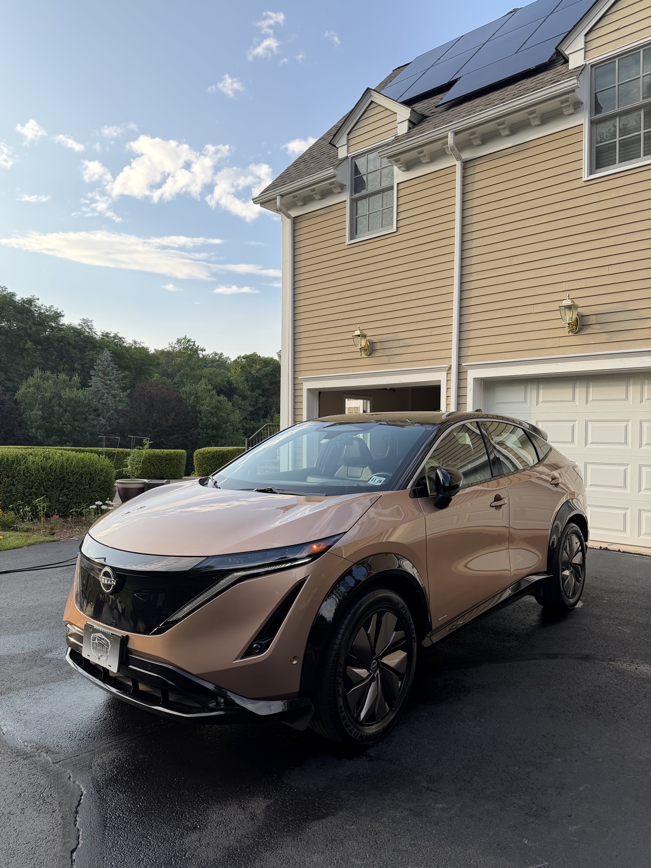 Copper Nissan Ariya front three-quarter view after detailing