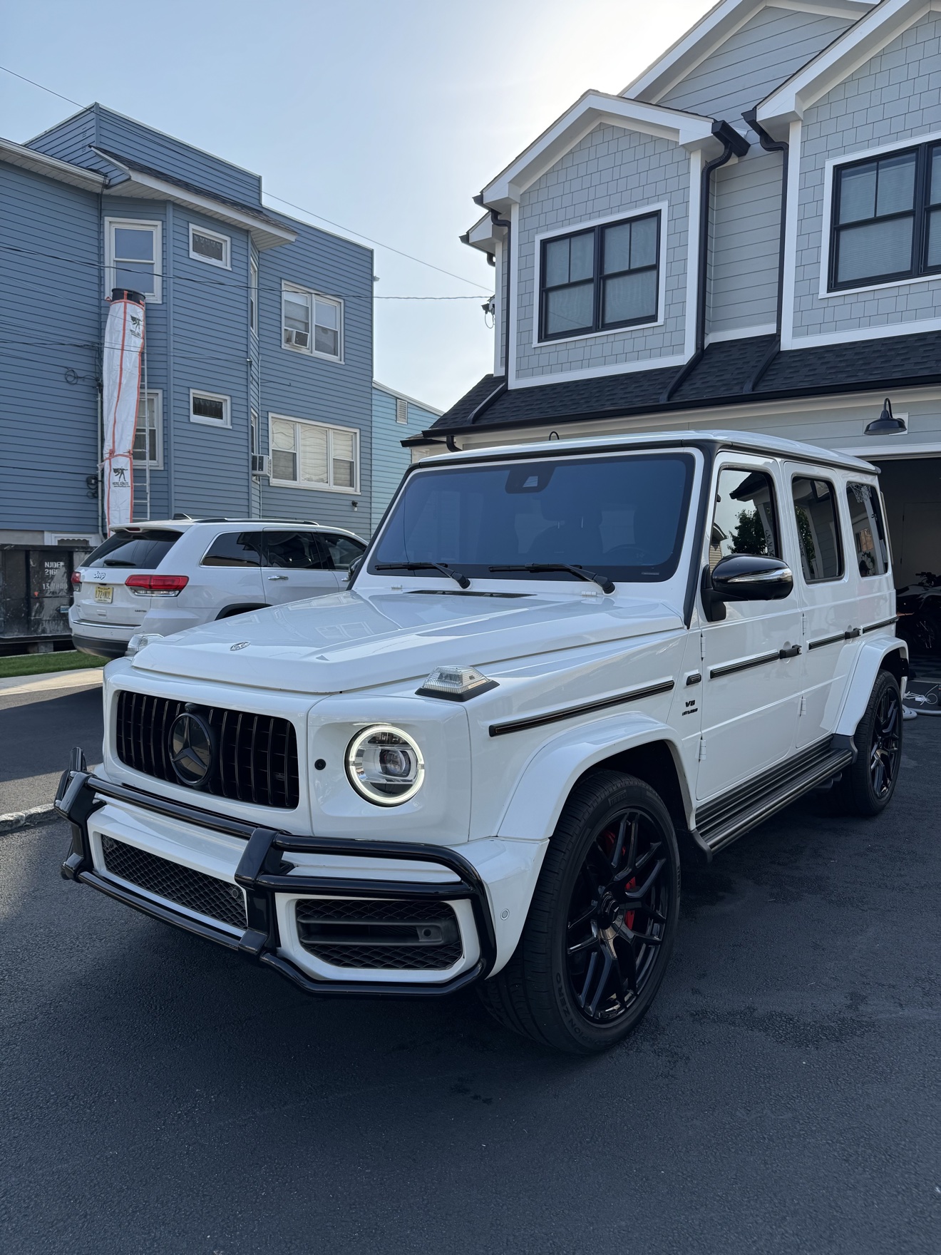 White Mercedes-AMG G 63 front angle after detailing