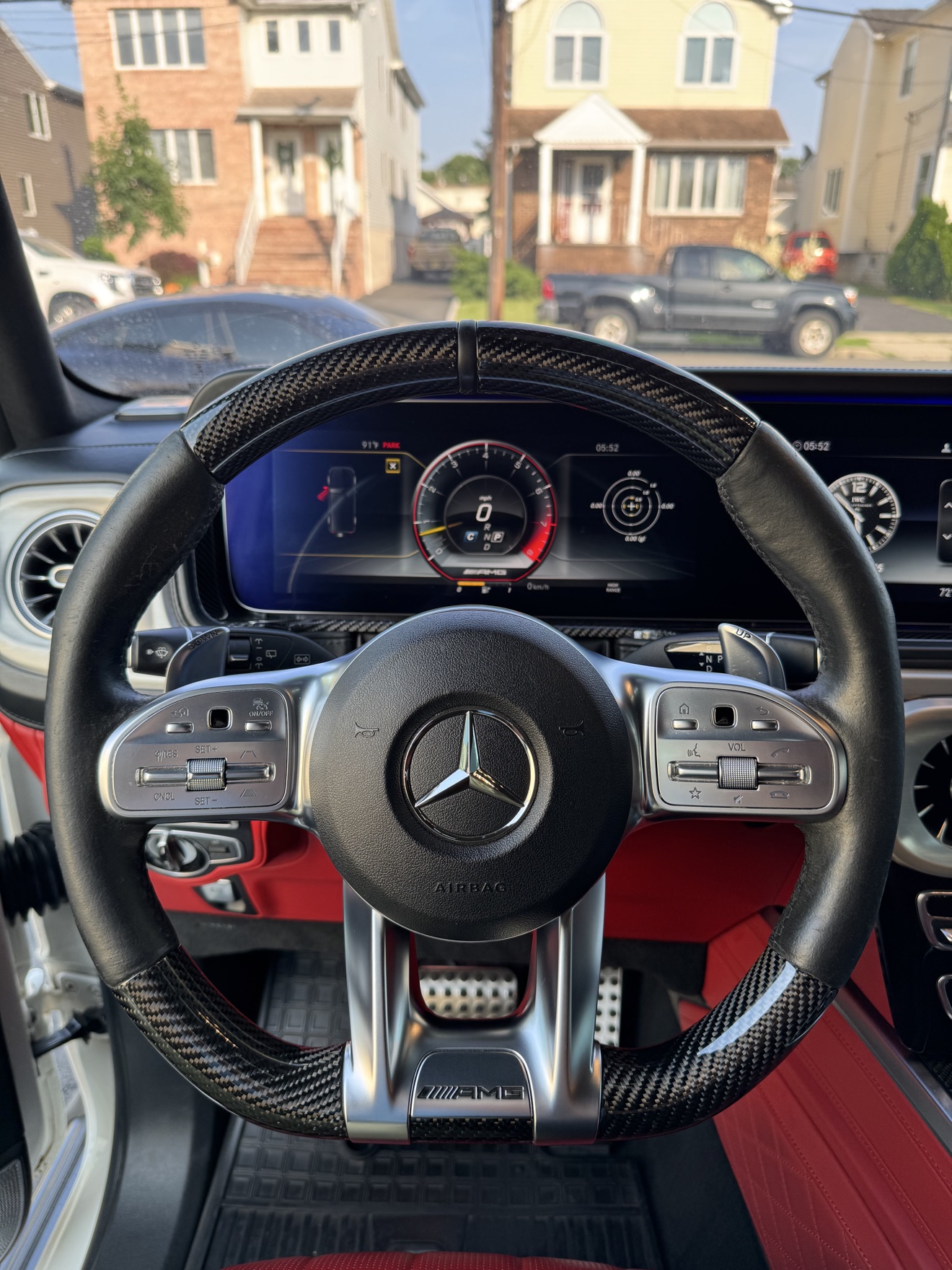 Carbon fiber AMG steering wheel inside the G-Wagon with red interior