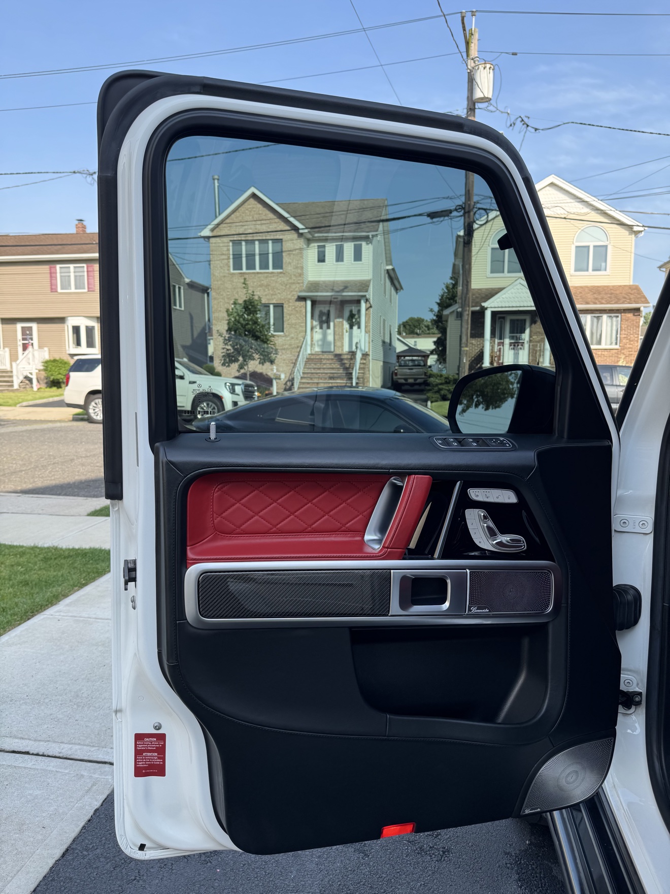 G-Wagon door panel with red quilted leather and Burmester speaker