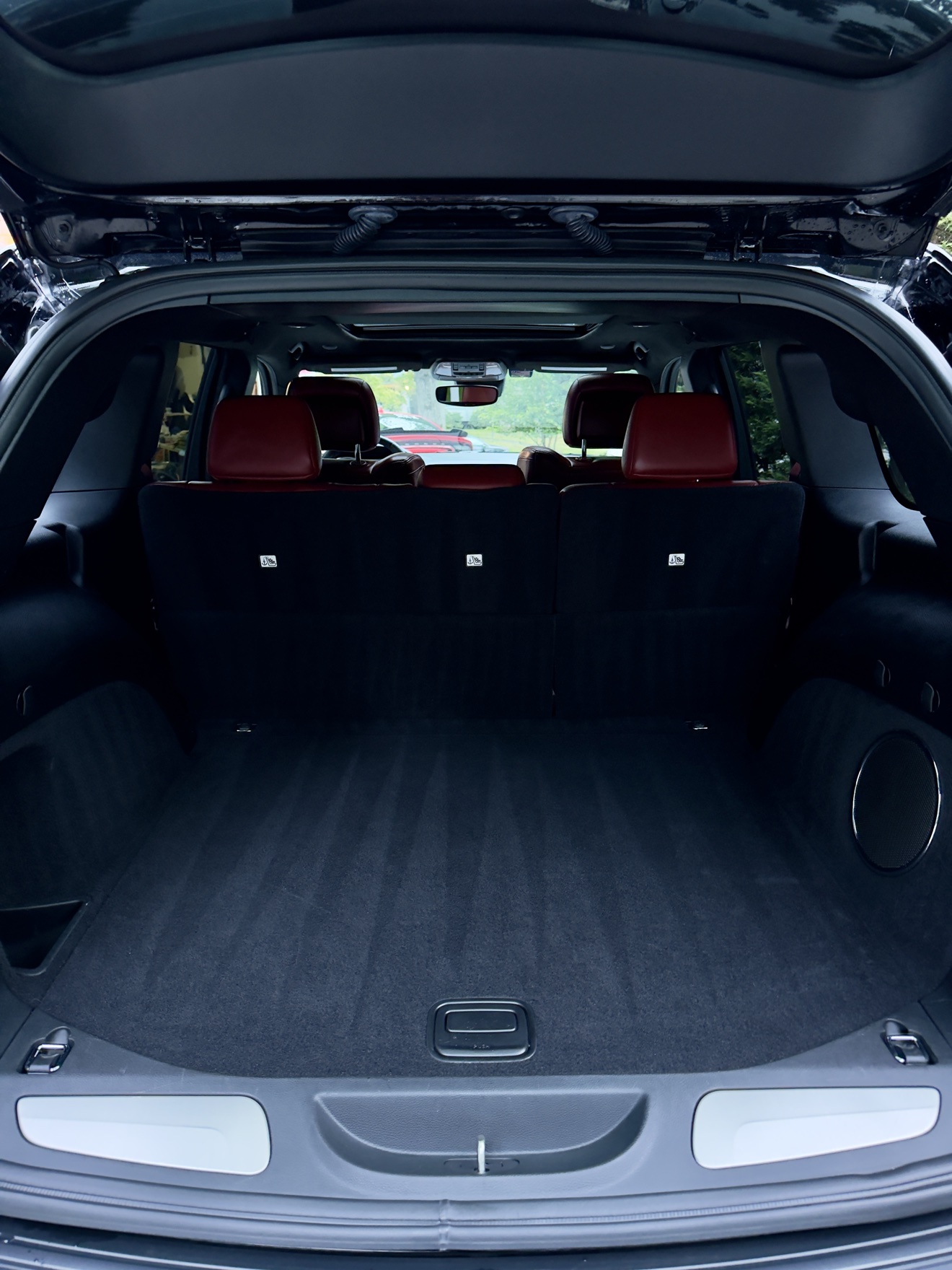 Trackhawk cargo area with fresh carpet stripes after detailing