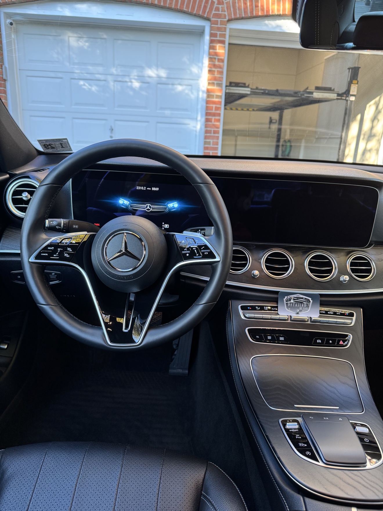 2023 Mercedes-Benz E350 cockpit with digital displays and Detailed by Yael card