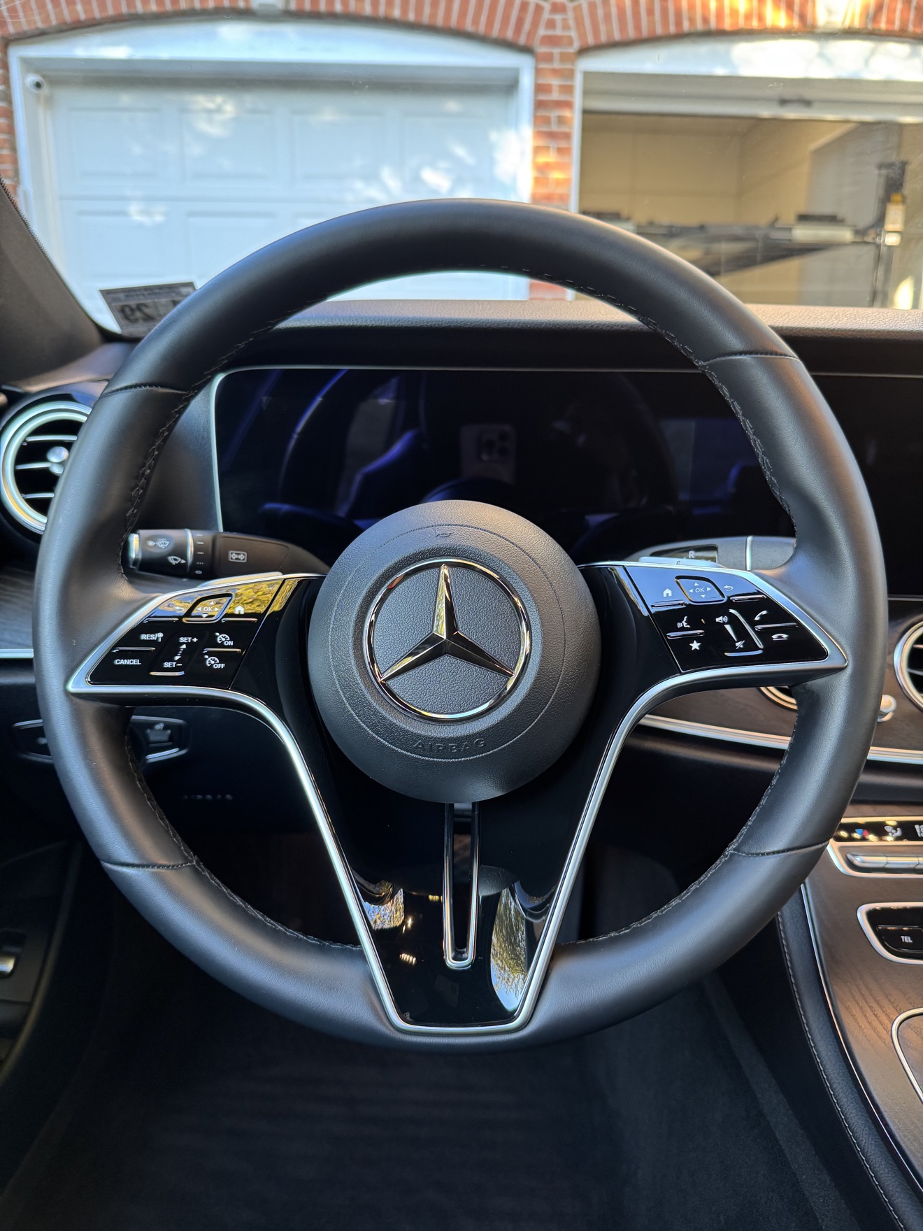 Close-up of the Mercedes steering wheel in a 2023 E350 after detailing